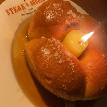 Steak & Bourbon - Brioche Bread with edible herb candle - Steakhouses Near Me - Louisville, Kentucky Steak & Bourbon - Brioche Bread with edible herb candle - Steakhouses Near Me - Louisville, Kentucky