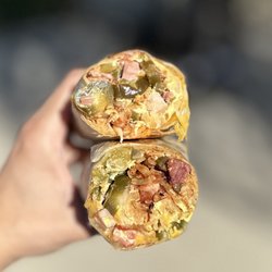 Ham 'n Scram - The Original Breakfast Burrito: Ham, Bacon, Egg, Cheese, Hash (+Crispy), Onion, Bell Pepper, Extra Grilled + Jalapeños + Salsa Inside | $14