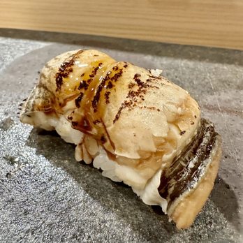 Sushi Aki - Anago nigiri. Mushy texture indicative of being cooked way in advance of serving. - Japanese Near Me - Honolulu, Hawaii