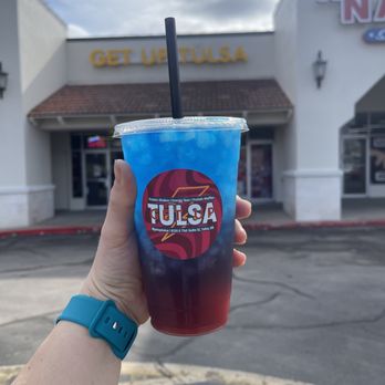 Get Up Tulsa - a hand holding a blue drink - Juice Bars & Smoothies Near Me - Tulsa, Oklahoma