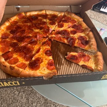 Pagliacci Pizza - Extra pepperoni pizza with spicy pepperoni and parsley cooked well done and light sauce - Pizza Near Me - Seattle, Washington