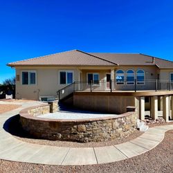 Improvement Pros - This round deck and entertaining area was a fun challenge. Lots of room for friends and family.