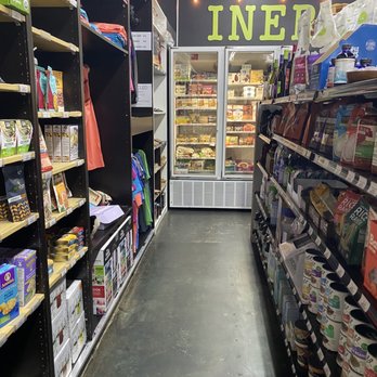 Inergy market - a grocery aisle with shelves of goods - Organic Stores Near Me - Oak Island, North Carolina