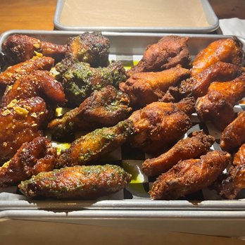 Foghorn Taproom - [left to right] Hot Honey Crunch, Garlic Parm, Dry Spice, and Extra Hot House Buffalo Sauce - Chicken Wings Near Me - San Francisco, California