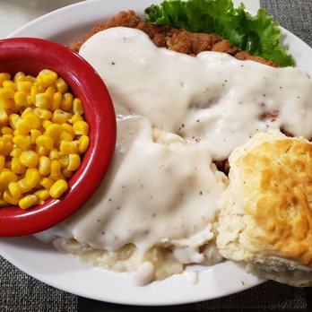 Farmhouse Restaurant - Hand breaded Pork loin, side of corn, biscuit and mash potatoes with gravy. - American Near Me - Branson, Missouri Farmhouse Restaurant - Hand breaded Pork loin, side of corn, biscuit and mash potatoes with gravy. - American Near Me - Branson, Missouri