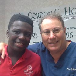 Gordon C Honig, DMD - It is smiles all around for Dr. Honig and his proud patient!