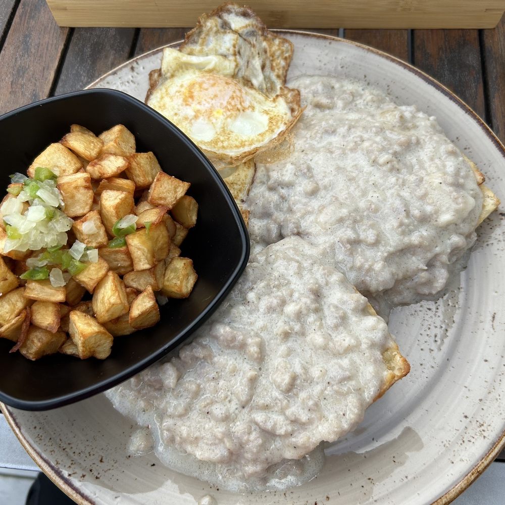 Biscuits and gravy with eggs and side of potatoes Biscuits and gravy with eggs and side of potatoes