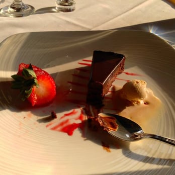 Ananda - Ananda's delectable flourless chocolate cake with a side of sea salt caramel ice cream... what could be better? - Indian Near Me - Fulton, Maryland
