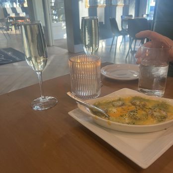 Che Bello Kitchen - Mushroom appetizer, Prosecco in glasses - Italian Near Me - Bloomington, Indiana