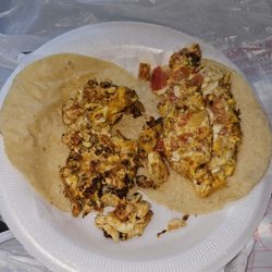 Tacos Al Pastor Dianita - Two breakfast tacos on corn tortillas.