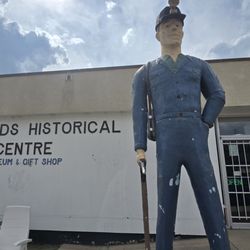 Badlands Historical Centre - Big John standing outside of the Badlands Historical Centre