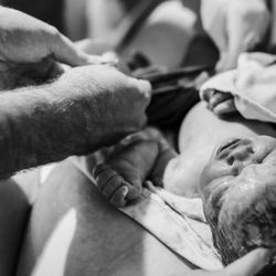 Graceful Birth Doula Services - Client cutting cord