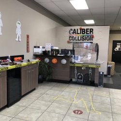 Caliber Collision - Coffee and candy this week! Where's the receptionist? In the middle of this photo - left of the plexiglass and behind the monitors.