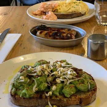 Caravan Kings Cross - The best breakfast I had in London! Smashed Avocado, Soy Pumpkin Seeds, Sprouts, Chilli and Hot Smoked Salmon & Scrambled Egg - Breakfast & Brunch Near Me - London, XGL