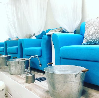 Garden Avenue Signature Organic Pedicures! - At Garden Avenue Boutique, we believe that a pedicure is not just a beauty treatment, but a complete sensory experience. That's why we offer an array of pedicures designed to rejuvenate your feet and relax your mind.

Our Garden Avenue Signature Spa Pedicure is the pinnacle of luxury and relaxation. This service begins with our signature soak, featuring a unique blend of organic essential oils and a layer of organic flower petals to soothe and soften your feet. The experience continues with an exfoliating scrub and callus removal as needed, followed by meticulous shaping and buffing of your nails. The highlight is a relaxing foot and leg massage, culminating in a cocoon of warmth with hot towel wraps. Your pampering session concludes with a polish of your choice from our exclusive GAB collection.

The Lavender Pedicure, a customer favorite, offers a tranquil escape. Immerse your feet in a soothing bath of organic lavender, followed by our gentle exfoliating scrub and callus treatment. The relaxation deepens with a foot and leg massage, leaving you in a state of bliss. A careful shaping and buffing of your nails prepare them for a final touch of elegance with a polish from our GAB collection.

Our Citrus Pedicure is perfect for those seeking a refreshing boost. Begin with a soak featuring sliced organic lemons or oranges, followed by our exfoliating scrub and specialized callus removal. After your nails are shaped and buffed, indulge in a revitalizing foot and leg massage. The treatment concludes with a polish from our exclusive GAB collection, leaving your feet both feeling and looking rejuvenated.

For those who desire a little extra indulgence, all our manicures and pedicures offer the option to add additional massage time at $1/minute. At Garden Avenue Boutique, every step of your pedicure journey is designed to provide an unparalleled experience of luxury and relaxation.