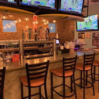 SandBar - Lovely bar area with ample entertainment. - Sports Bars Near Me - Hull, Massachusetts