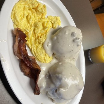 Four Corners - a plate of food with eggs, bacon, and gravy - Burgers Near Me - Tracy, California Four Corners - a plate of food with eggs, bacon, and gravy - Burgers Near Me - Tracy, California