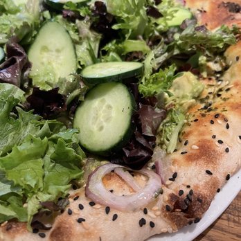 California Pizza Kitchen - Closeup of the crust on the avocado super green - Pizza Near Me - Paramus, New Jersey California Pizza Kitchen - Closeup of the crust on the avocado super green - Pizza Near Me - Paramus, New Jersey
