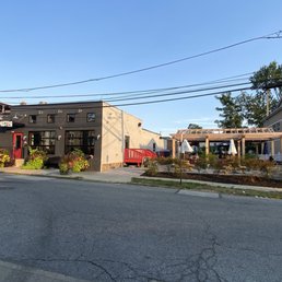 The area on the right, the outdoor patio, has a grass section.