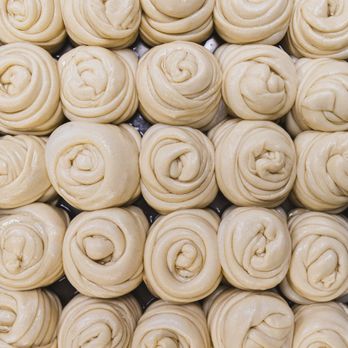 Cafe Malabar - a close up of a pile of doughnuts - Indian Near Me - Victoria, British Columbia