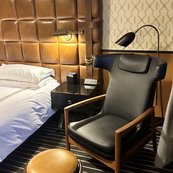 Gild Hall, A Thompson Hotel - Chair with stool - Hotels Near Me - New York, New York Gild Hall, A Thompson Hotel - Chair with stool - Hotels Near Me - New York, New York