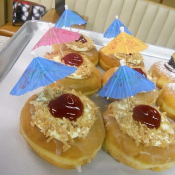 10th Street Baking - a tray of doughnuts with umbrellas - Bakeries Near Me - Belleville, Illinois 10th Street Baking - a tray of doughnuts with umbrellas - Bakeries Near Me - Belleville, Illinois
