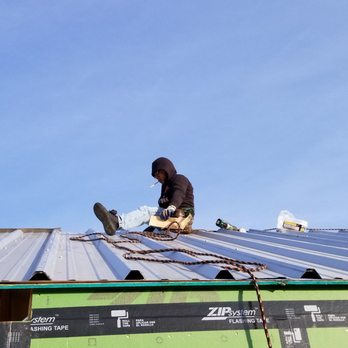 Ranch Hand Roofing - [18 of 19] Installing new metal panels for the roof. - General Contractors Near Me - Dripping Springs, Texas