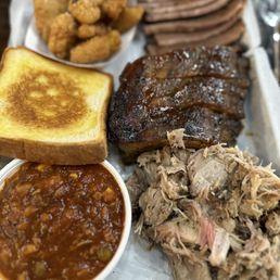 Brisket (pass), ribs (decent), pulled pork (juicy, great flavor). Corn nuggets (so good!), toast, Brunswick stew (pretty good). Brisket (pass), ribs (decent), pulled pork (juicy, great flavor). Corn nuggets (so good!), toast, Brunswick stew (pretty good).