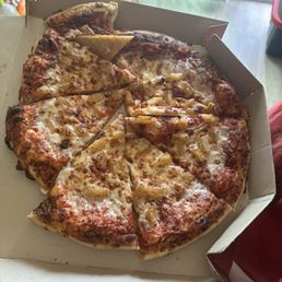 One very jumbled up and messy pizza