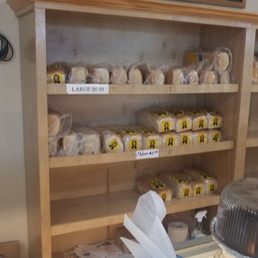a bakery counter with a variety of pastries