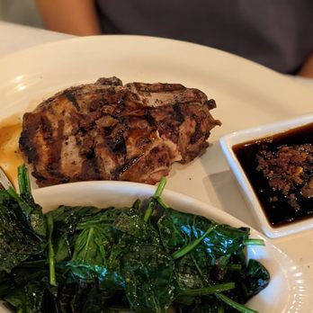 The Crossing Steakhouse - Pork chops with bourbon glaze with spinach - Seafood Near Me - Norcross, Georgia