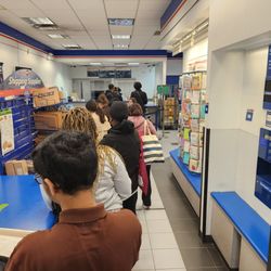 US Post Office - No sense of urgency even though there is 10 people in front of me and 10 people behind me. To top it off the parcel drop box Is broken.