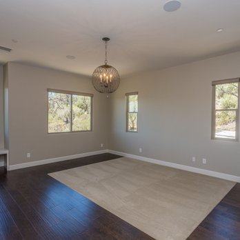 Cutting Edge Flooring - a living room with hardwood floors and a chandelier - Flooring Near Me - Prescott, Arizona Cutting Edge Flooring - a living room with hardwood floors and a chandelier - Flooring Near Me - Prescott, Arizona