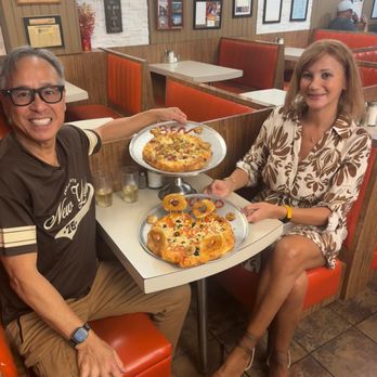 Louis Restaurant And Pizza - My wife and I holding the heart shape pizzas - Pizza Near Me - Vanier, Ontario