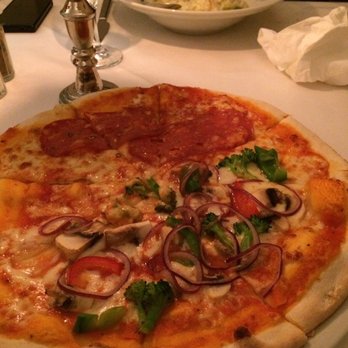 Capriccio - Half vegetariana pizza and half salami pizza - Italian Near Me - Hamburg, HH Capriccio - Half vegetariana pizza and half salami pizza - Italian Near Me - Hamburg, HH