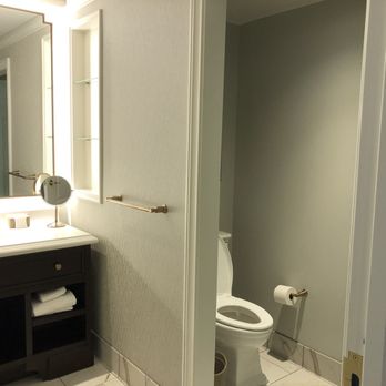 Hotel Carmichael - Spacious bathroom with a sink area, large shower "room" and a door for the toilet. - Hotels Near Me - Carmel, Indiana
