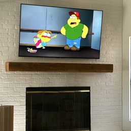 65 inch tv over fireplace with outlet.