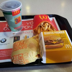 McDonald's - A cheese burger value meal, with a quarter pounder on the side.