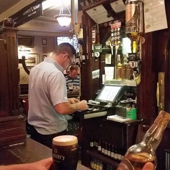 Flannerys Bar - Mulling over my inevitable purchase with a pint of Guinness... - Pubs Near Me - Limerick, LK