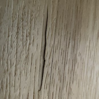 Carpet Liquidators - One of the cracks in our luxury vinyl plank flooring - Flooring Near Me - Everett, Washington