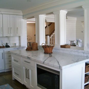 CT Handy - a kitchen with white cabinets and marble counter tops - Handyman Near Me - Norwalk, Connecticut