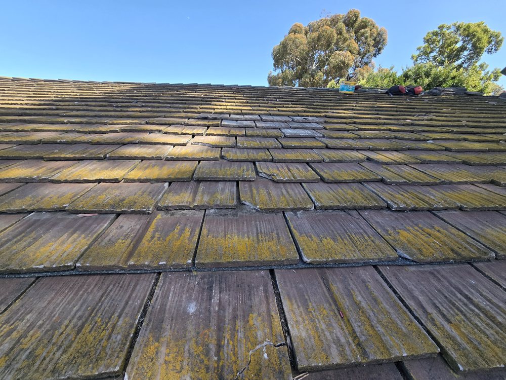 Slide of J&E Roofing Services