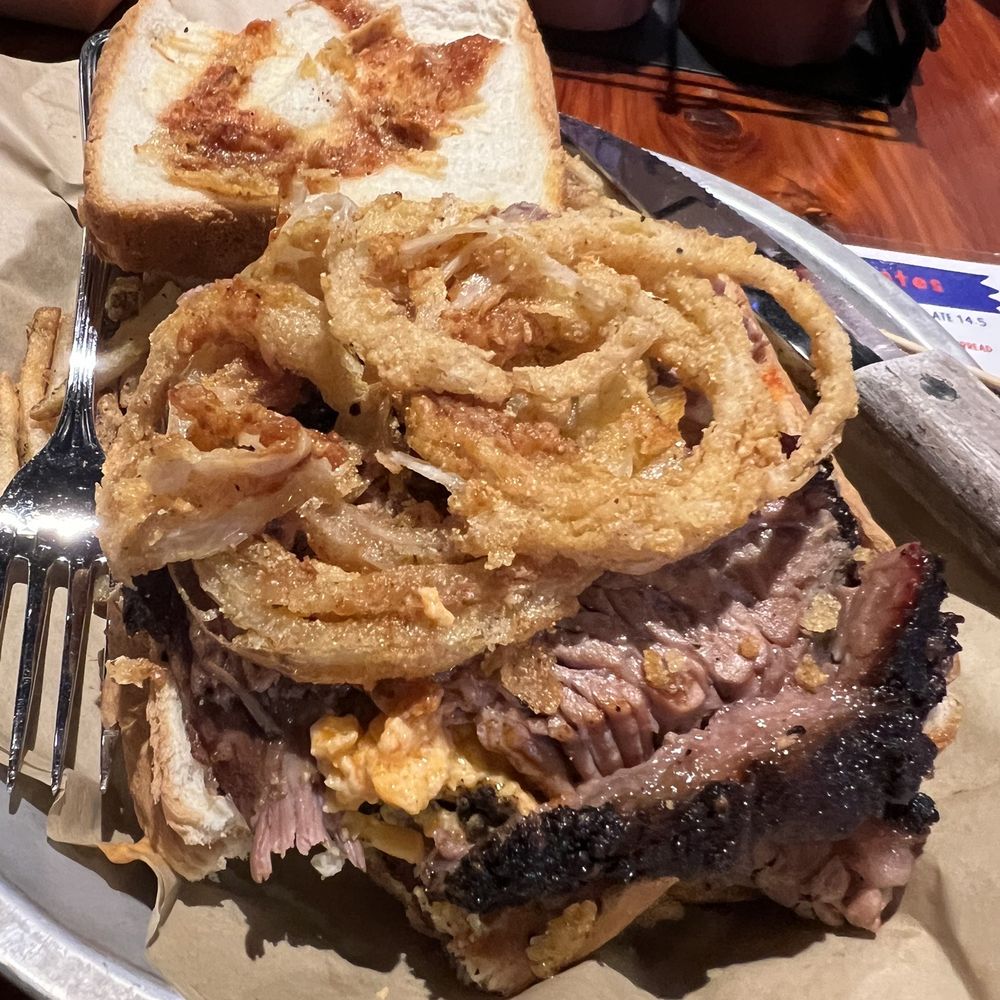 Brisket melt with the top piece of toast off. Brisket melt with the top piece of toast off.