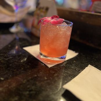 Whiskey Kitchen - a glass of alcohol on a table - Bars Near Me - Mt Dora, Florida