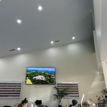 LA VIE Nails & Spa - Relaxing Tv show and product on the wall in manicure section. - Nail Salons Near Me - Selbyville, Delaware