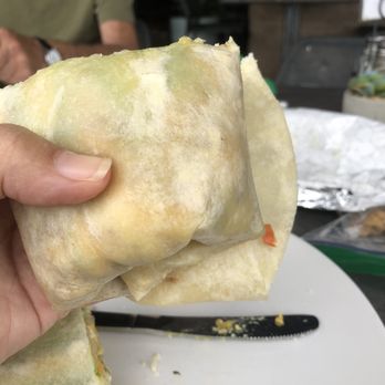Seis Kitchen - Breakfast burrito with tortilla overhanging due to it not being full - Mexican Near Me - Tucson, Arizona Seis Kitchen - Breakfast burrito with tortilla overhanging due to it not being full - Mexican Near Me - Tucson, Arizona