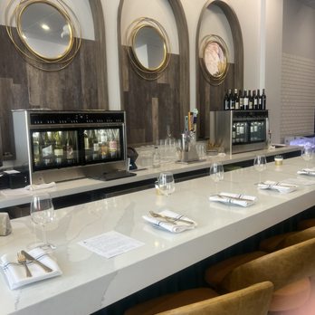 Ahso Cellars - a long bar with wine glasses on it - Wine Bars Near Me - Brambleton, Virginia
