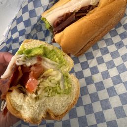 The Famous Deli Sub (avocado, roast beef, ham, turkey Swiss) on French roll