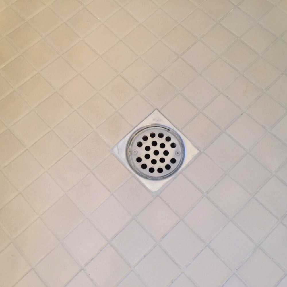 Regrout Systems - Shower basin after clean, regrout, color, seal. Too bad tiles were already discolored prior to sealing. - Grout Services Near Me - Long Beach, California Regrout Systems - Shower basin after clean, regrout, color, seal. Too bad tiles were already discolored prior to sealing. - Grout Services Near Me - Long Beach, California