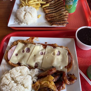 La Granja Restaurant - Top: Pollo a la plancha, arroz, frijoles negros, papitas Bottom: Milanesa de Pollo, arroz, frijoles negros, y maduros - Peruvian Near Me - Hialeah Gardens, Florida La Granja Restaurant - Top: Pollo a la plancha, arroz, frijoles negros, papitas Bottom: Milanesa de Pollo, arroz, frijoles negros, y maduros - Peruvian Near Me - Hialeah Gardens, Florida